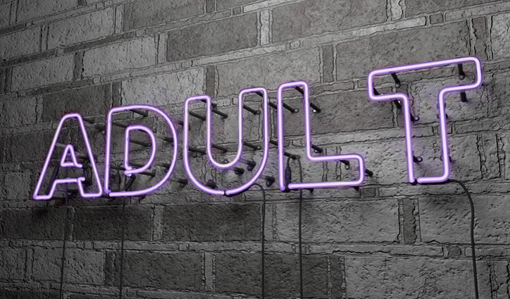 neon sign reads adult