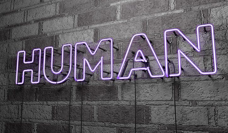 neon sign reads human